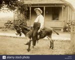 hefty-old-man-riding-a-too-small-donkey-CNKBH7.jpg