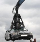 Car-on-scrap-yard-crane-220x231.jpg